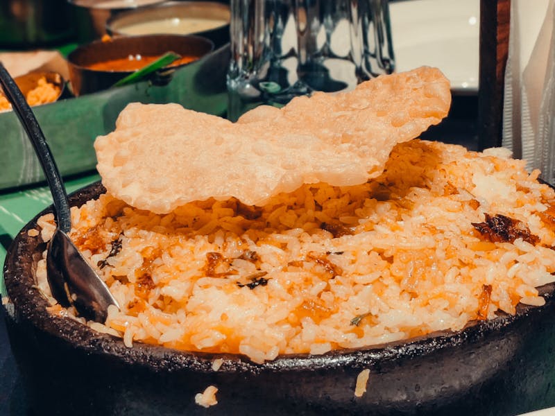 Chicken biryani with papadum